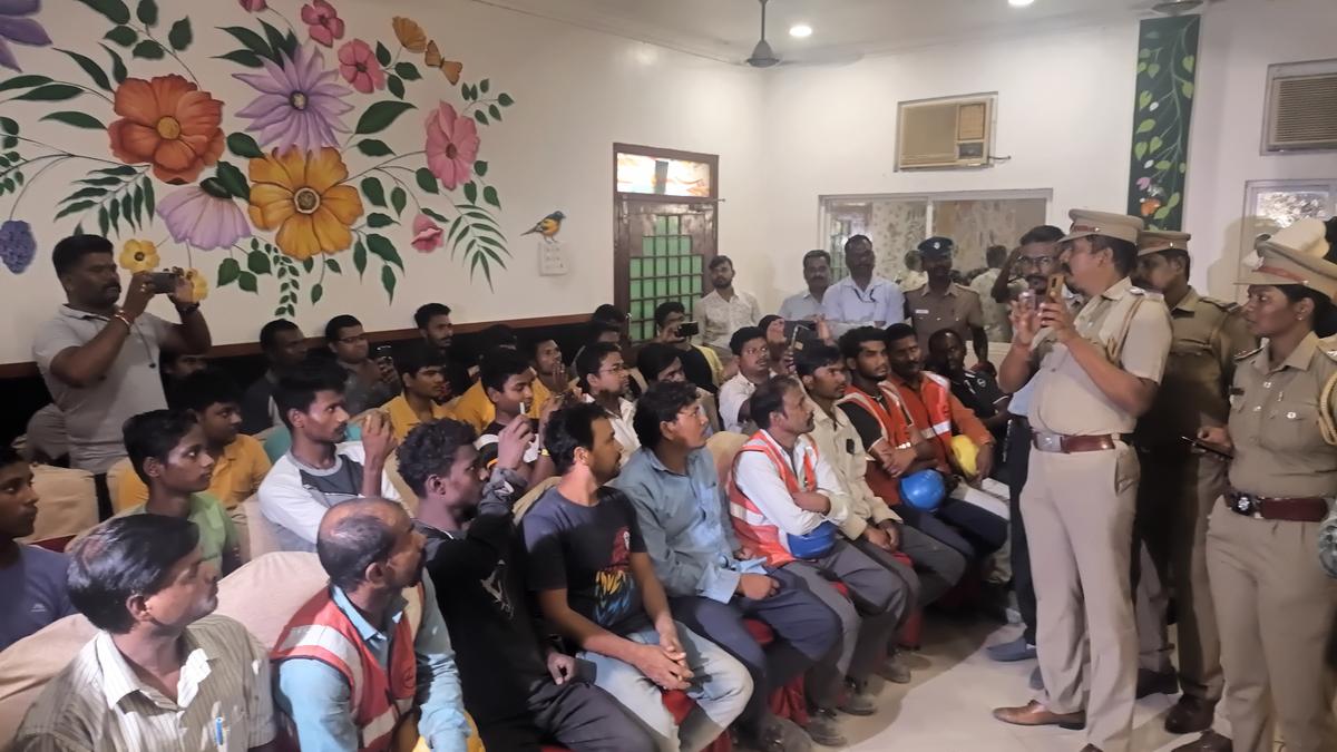 Police personnel meet migrant workers in Chennai to assure their safety