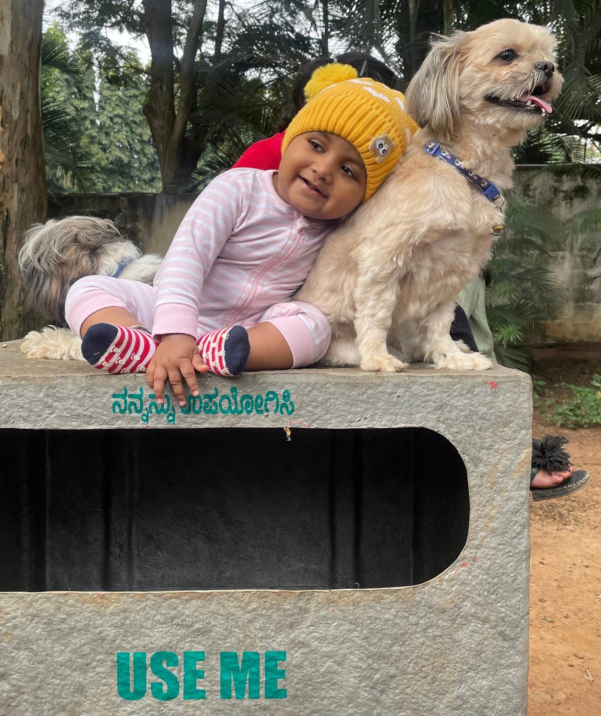 A child with its pet dog at PET-A-THON to create awareness on animal rights at Cubbon Park in 2022