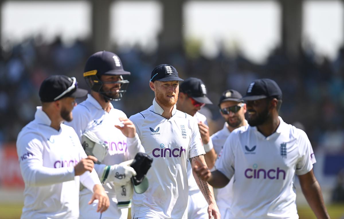 England captain Ben Stokes and team mates leave the field at lunch during day four of the 3rd Test Match between India  and England at Saurashtra Cricket Association Stadium on February 18, 2024 in Rajkot.