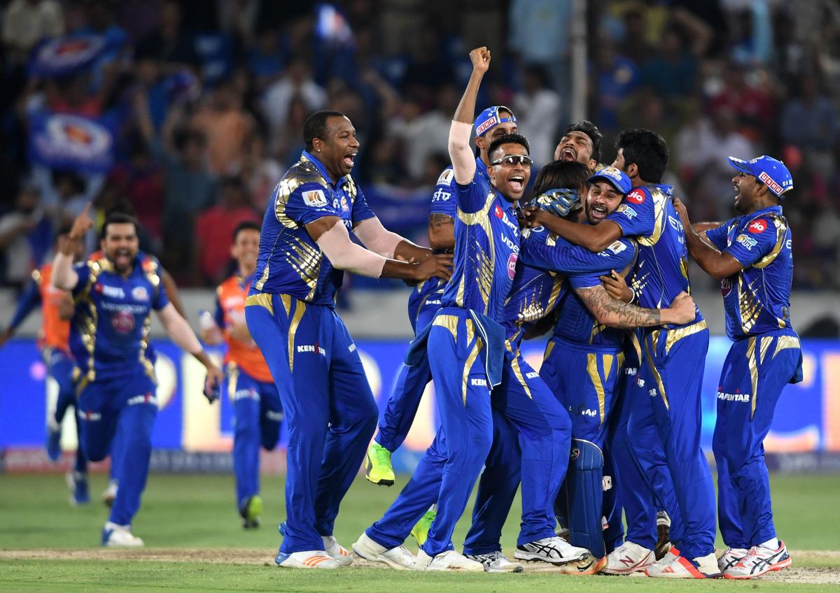 The victorious Mumbai Indians team celebrates the win against Rising Pune Supergiant in the Indian Premier League (IPL) 2017 Twenty20 cricket tournament final at the Rajiv Gandhi International Stadium in Hyderabad on May 21, 2017.  