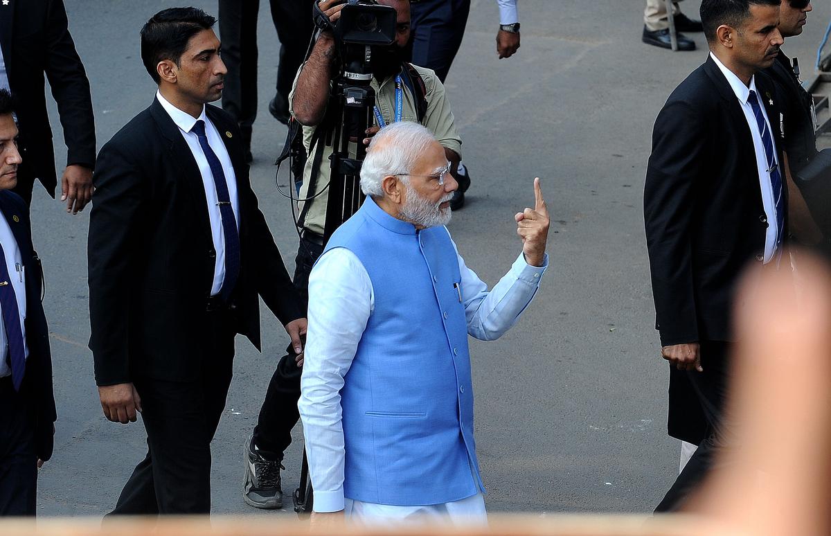 Prime Minister Narendra Modi shows his inked finger after casting his vote in Ahmedabad on December 05, 2022.