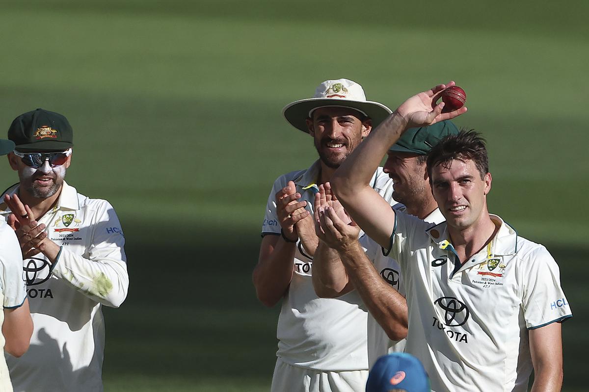 Australian captain Pat Cummins celebrates after taking 10 wickets in the second Test against Pakistan in Melbourne on December 29, 2023.