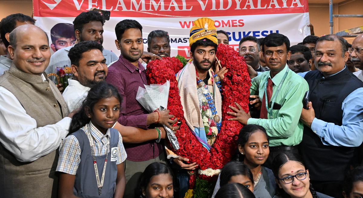 Chess player D. Gukesh, who won the FIDE Candidates tournament, being felicitated by his alma mater Velammal at the airport.