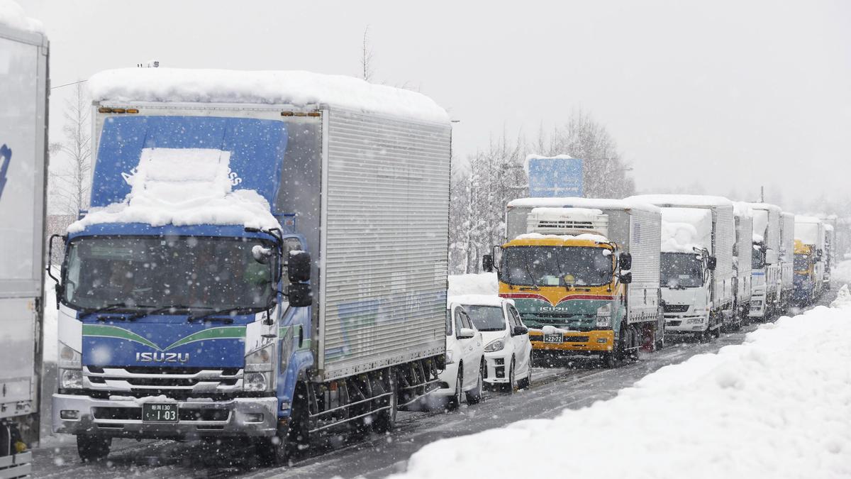 Snow piles deep in northern Japan, strands vehicles, three dead