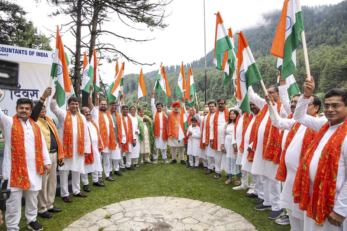 Members of the ICAI raise the national flag in Pahalgam, Jammu and Kashmir, on August 15, 2025.
