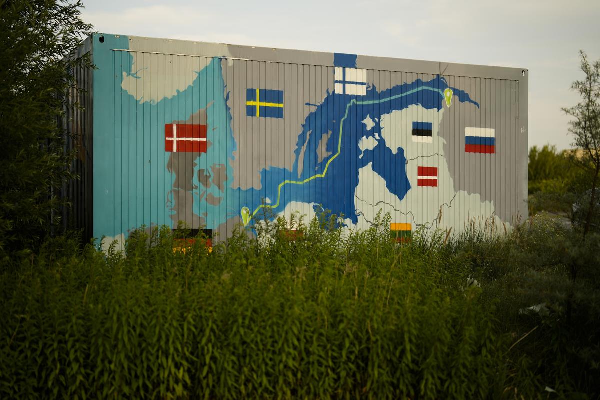 A painting showing the Nord Stream pipelines is displayed on a container near the Nord Stream 1 Baltic Sea pipeline in Lubmin, Germany.