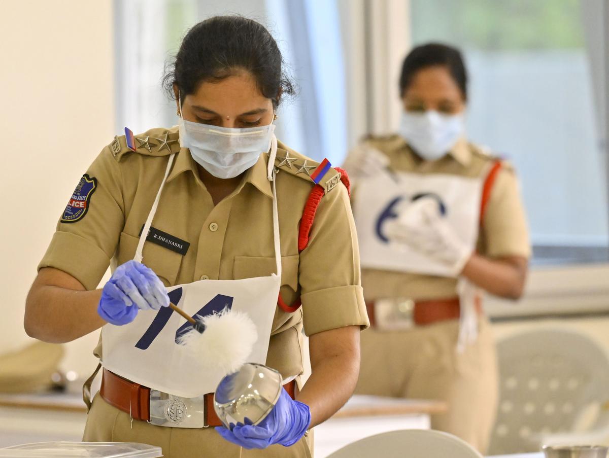 A personnel of Telangana police attending a session on forensic evidence collection as part of the first Telangana Police Duty Meet 2024 at RBVRR Telangana Police Academy in Hyderabad.