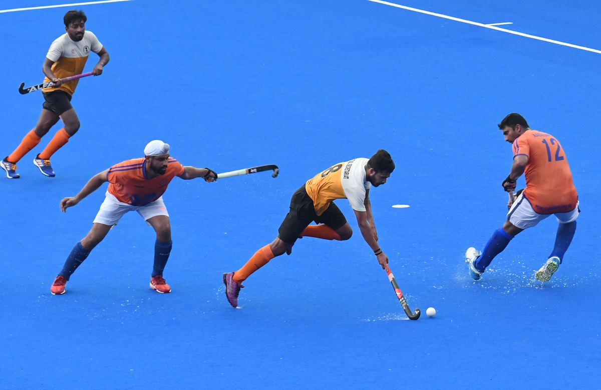 G. Anket Balasaheb, centre, of Central Secretariat  in action against   Indian Oil Corporation at the 94th All India MCC Murugappa Gold Cup hockey at the Mayor  Radhakrishnan Stadium in Chennai on Thursday, August 31, 2023.