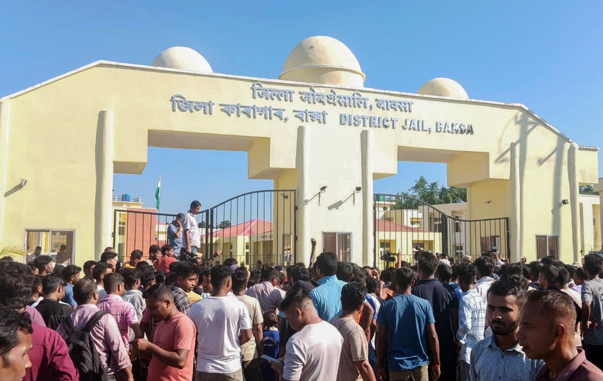 Police personnel try to stop as protestors are enraged over the shifting of five accused in connection with the death of Late singer Zubeen Garg to the newly-constructed prison at Mushalpur, in Baksa on October 15, 2025.