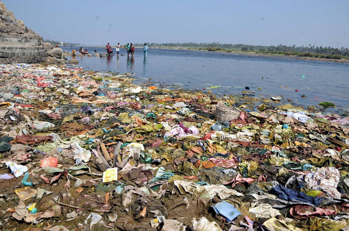 A portion of the bathing ghat at the Cauvery abutting Arulmigu Magudeeswarar Temple is clogged with clothes and other articles discarded by devotees, in Erode.
PHOTO: M. GOVARTHAN