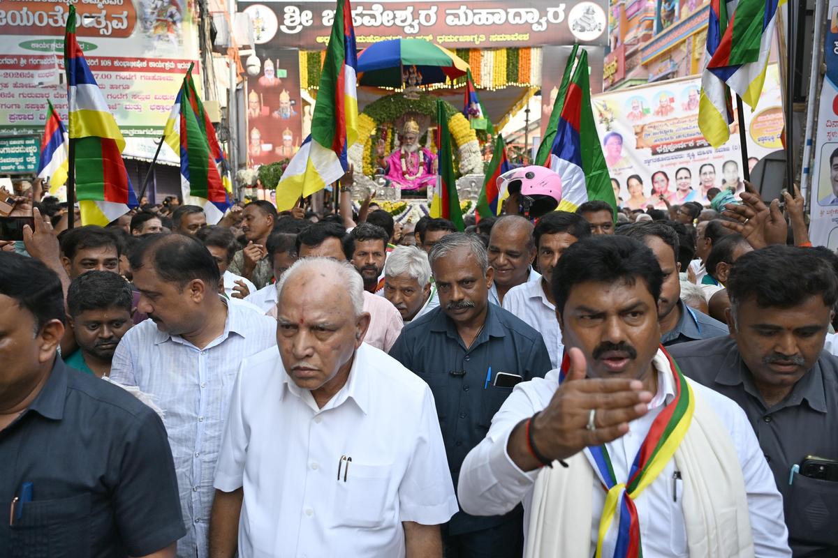 Chief Minister B.S. Yediyurappa and B.Y. Raghavendra, Shivamogga MP, participating in the Addapallakki Utsava at Shivamogga on Sunday (May 17).