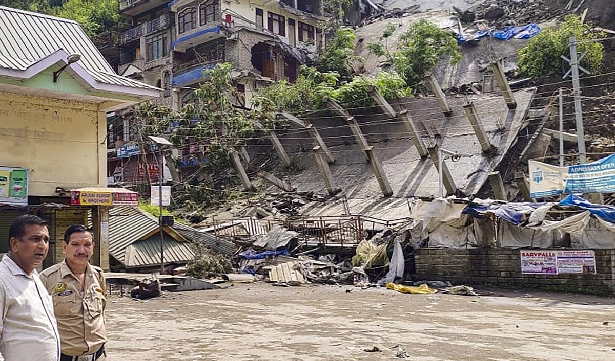 Buildings collapse due to a rain-triggered landslide at Anni town, in Kullu district on August 24, 2023.