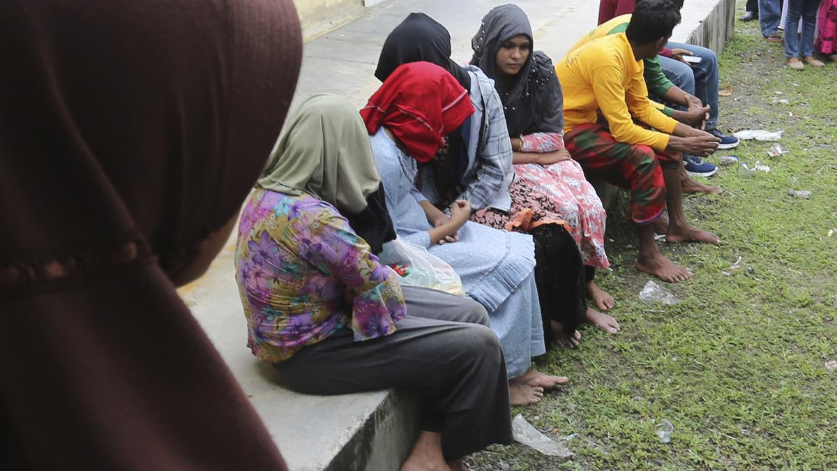 A wooden boat carrying dozens of Rohingya Muslim migrants capsizes off Indonesia's coast