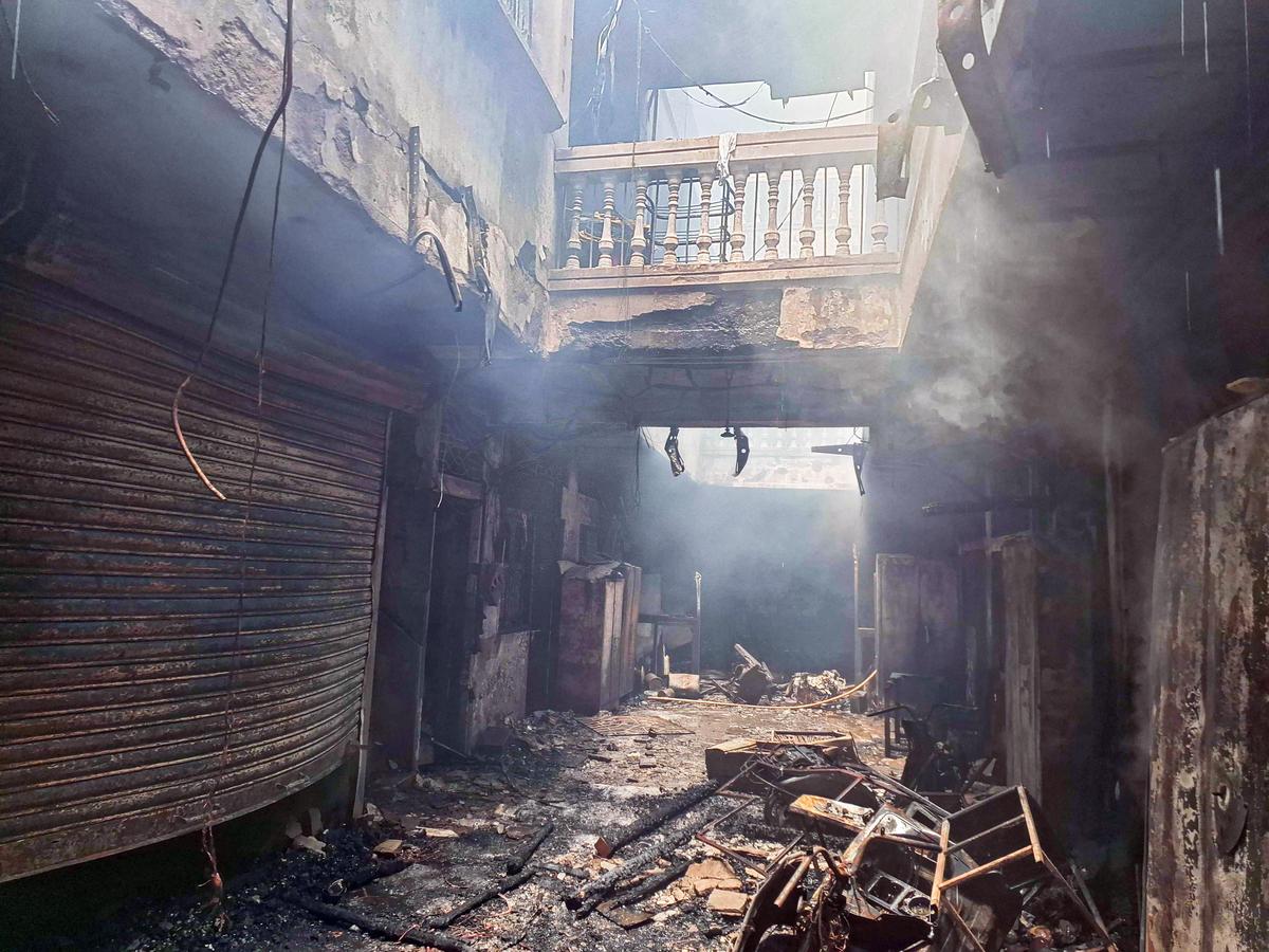 A view of the charred remains after a fire broke out at the Gulzar House near Charminar, in Hyderabad.