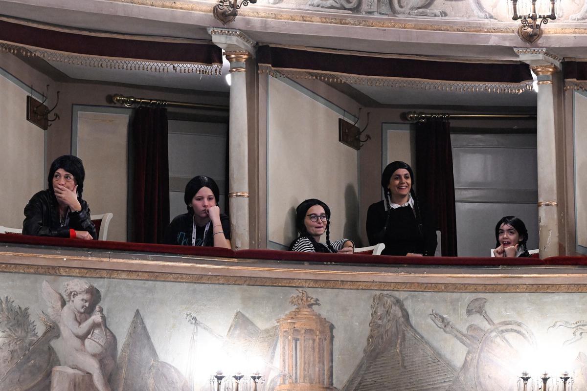 People dressed as Wednesday Addams, attend Tim Burton’s press conference during Lucca Comics and Games, for the premiere of Netflix’s new series ‘Wednesday’ in Lucca, Italy