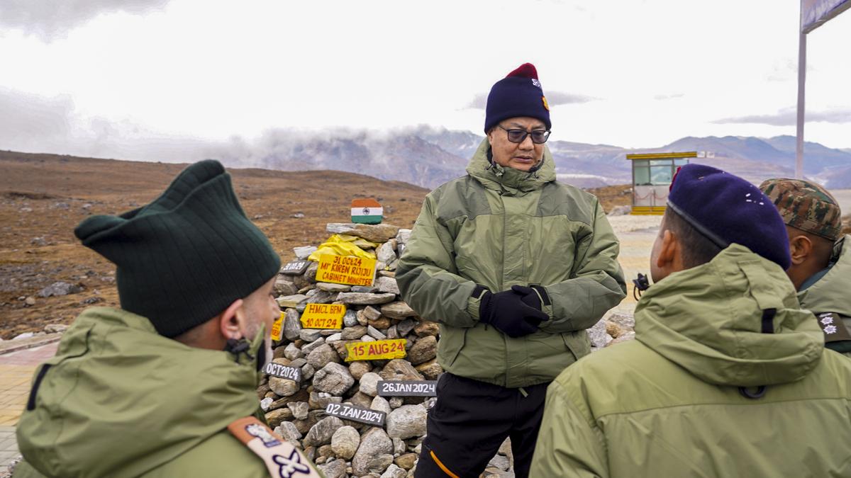 Rijiju interacts with Chinese soldiers near Tawang