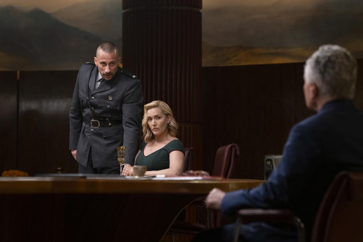 This image released by HBO shows Kate Winslet, center, and Matthias Schoenaerts, left, in a scene from ‘The Regime’