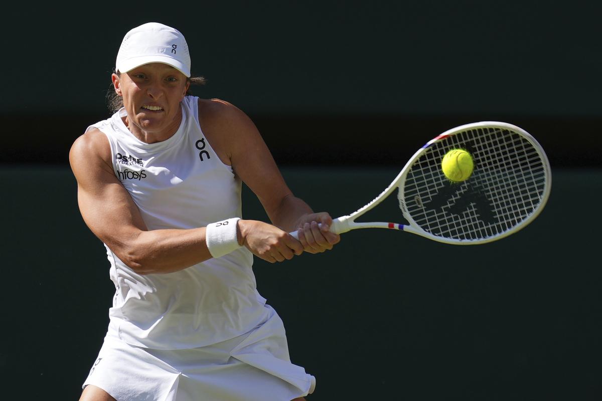 Iga Swiatek of Poland returns to Amanda Anisimova of the U.S. during the women’s singles final match at the Wimbledon Tennis Championships in London. Iga Swiatek of Poland returns to Amanda Anisimova of the U.S. during the women’s singles final match at the Wimbledon Tennis Championships in London.