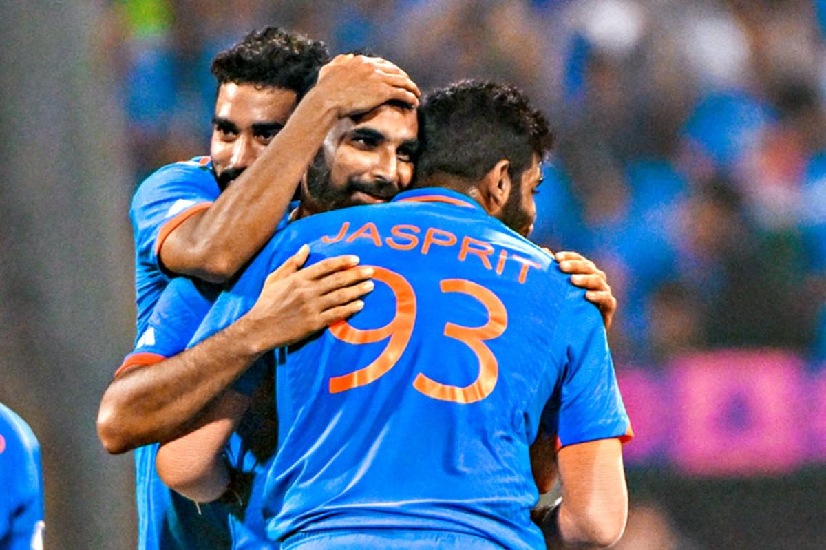 Mohammed Shami, Mohammed Siraj and Jasprit Bumrah celebrate after Shami takes his fifth wicket during ICC Cricket World Cup 2023 Semi Final India and New Zealand.