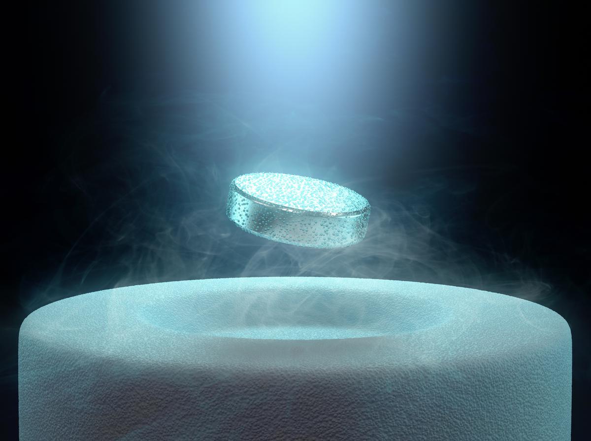 Image concept of a magnet levitating above a superconductor.