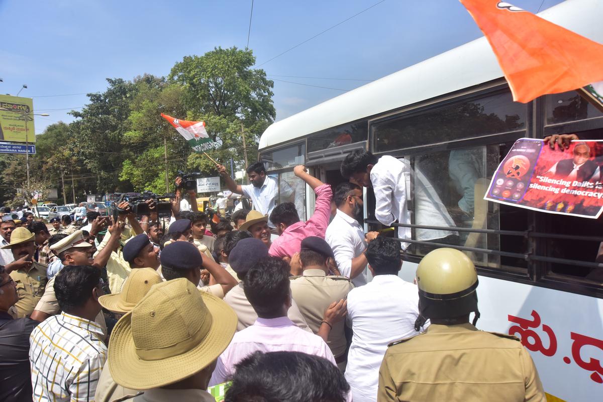 Police detaining members of the Youth Congress who tried to lay siege to the RSS office in Hubballi on Saturday.