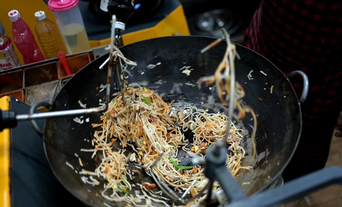 This Chennai fast food joint uses an automated machine to prepare fried rice and noodles