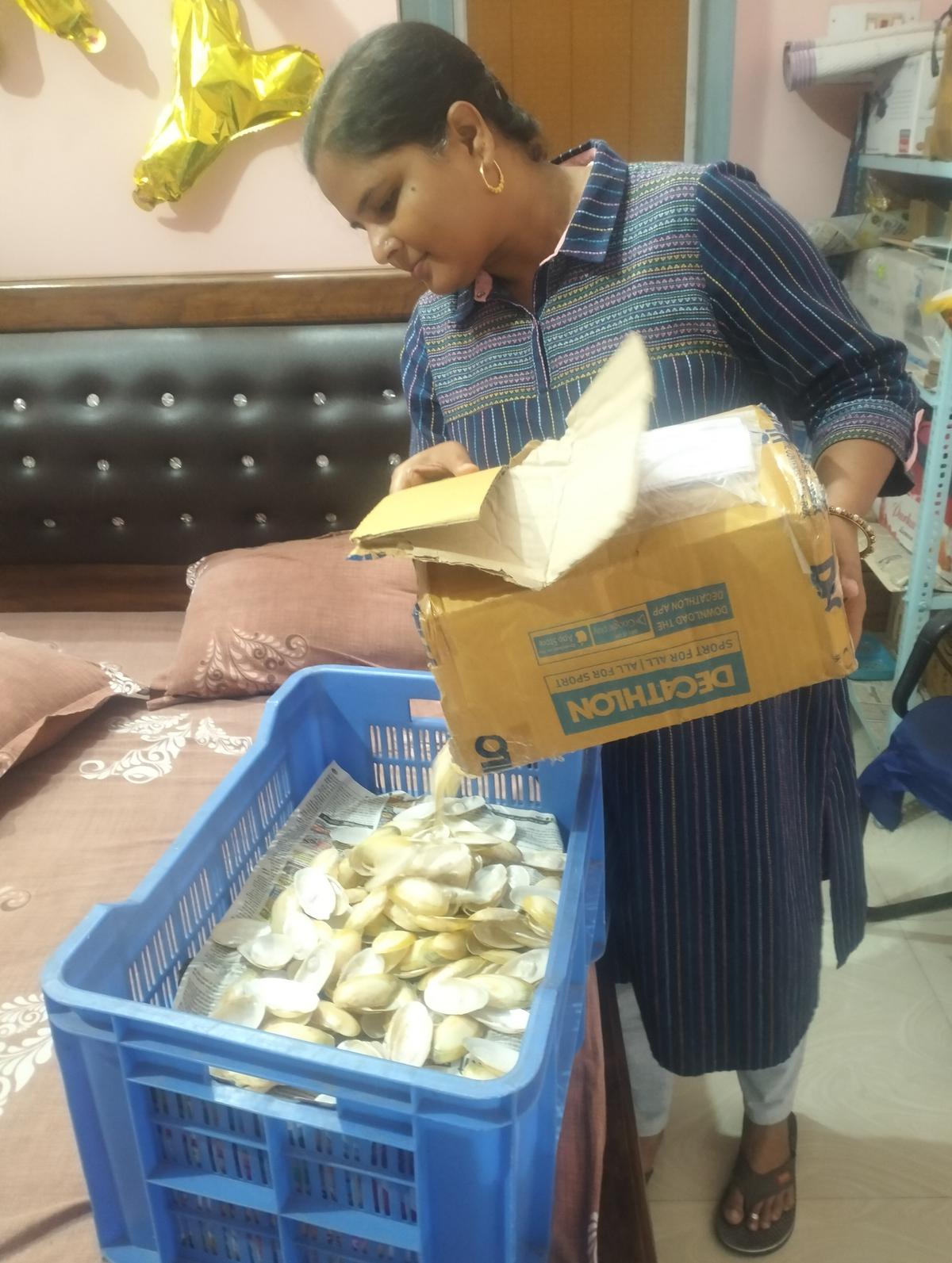 Madhu Patel with harvested oysters at her house in Rajgir in the Nalanda district. 