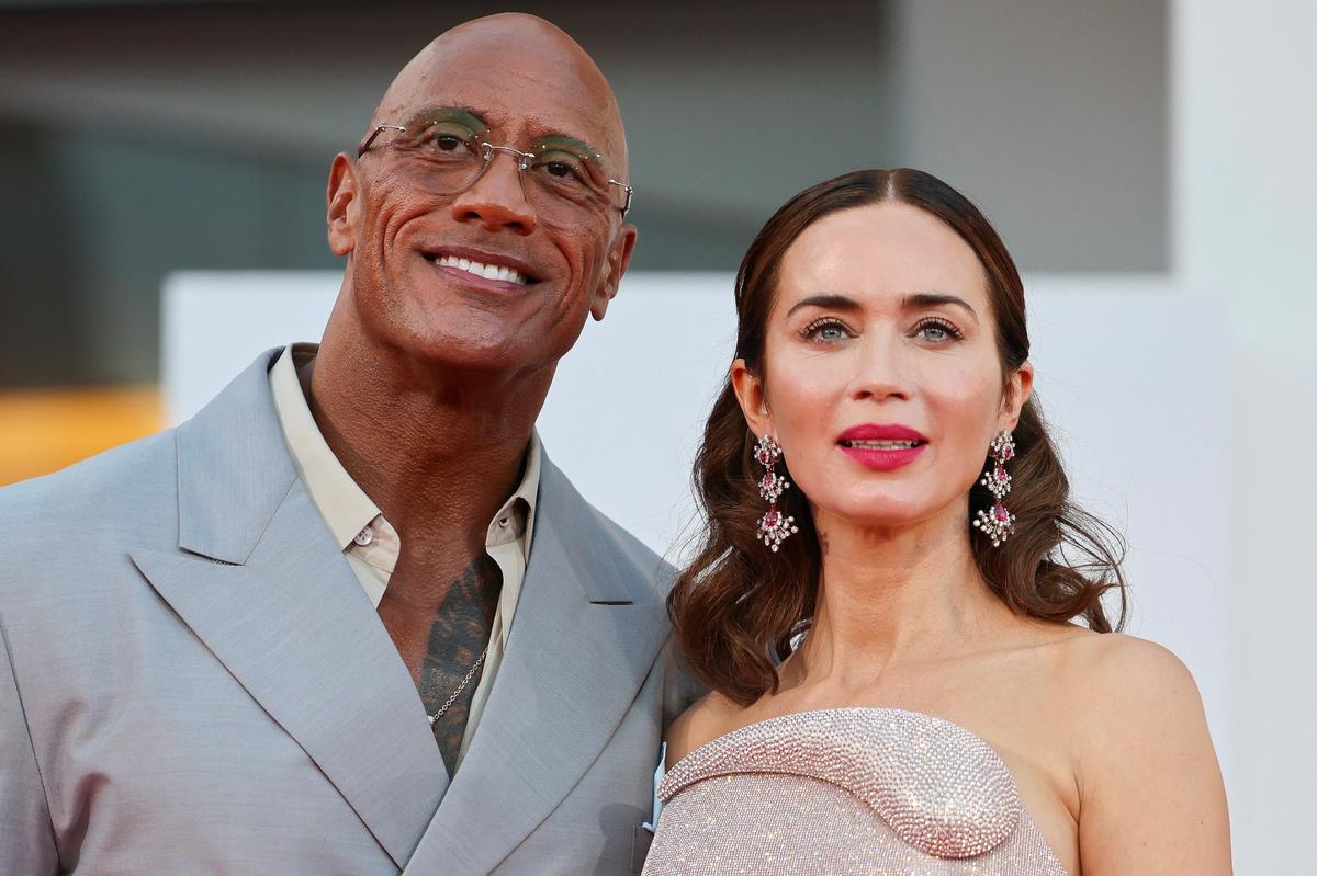 Cast members Dwayne Johnson and Emily Blunt pose on the red carpet during arrivals for the screening “The Smashing Machine” in competition, at the 82nd Venice Film Festival, Venice, Italy, September 1, 2025.