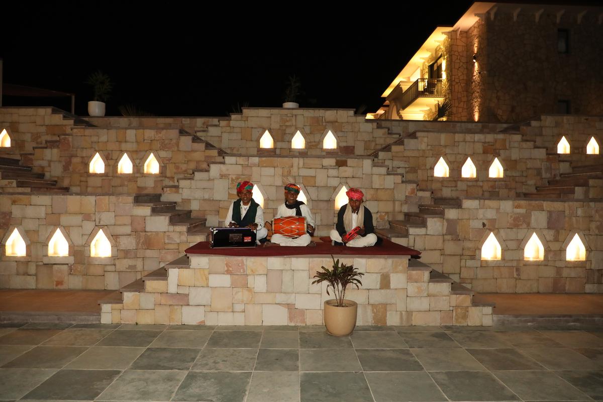 Manganiyar musicians perform in the stepwell-style courtyard at the resort.