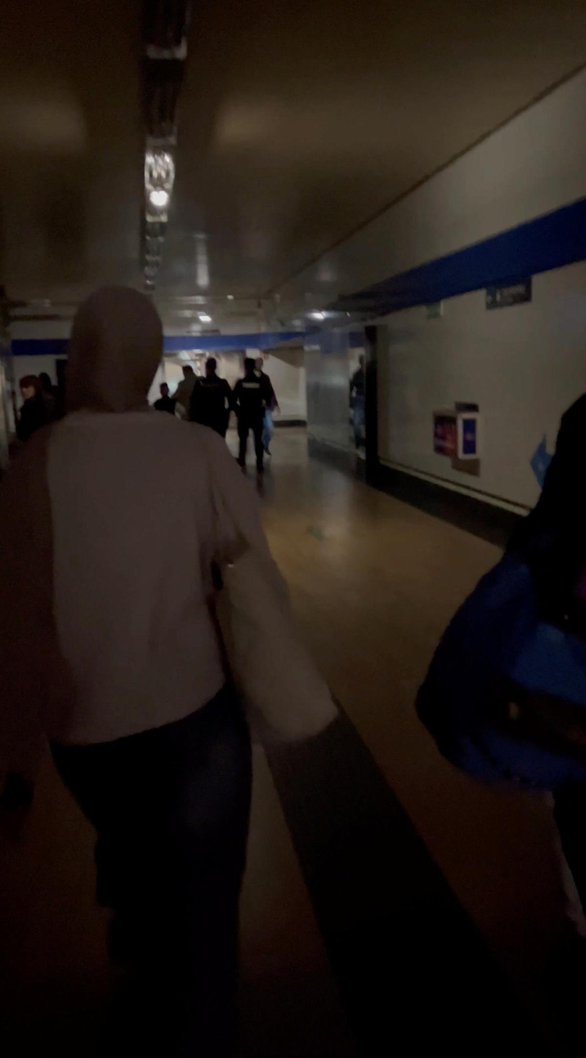 People walk through a metro station during a power outage in Madrid, Spain on April 28, 2025, in this screengrab obtained from a video posted on social media. Photo: Masha/Masha_Zha Via Reuters