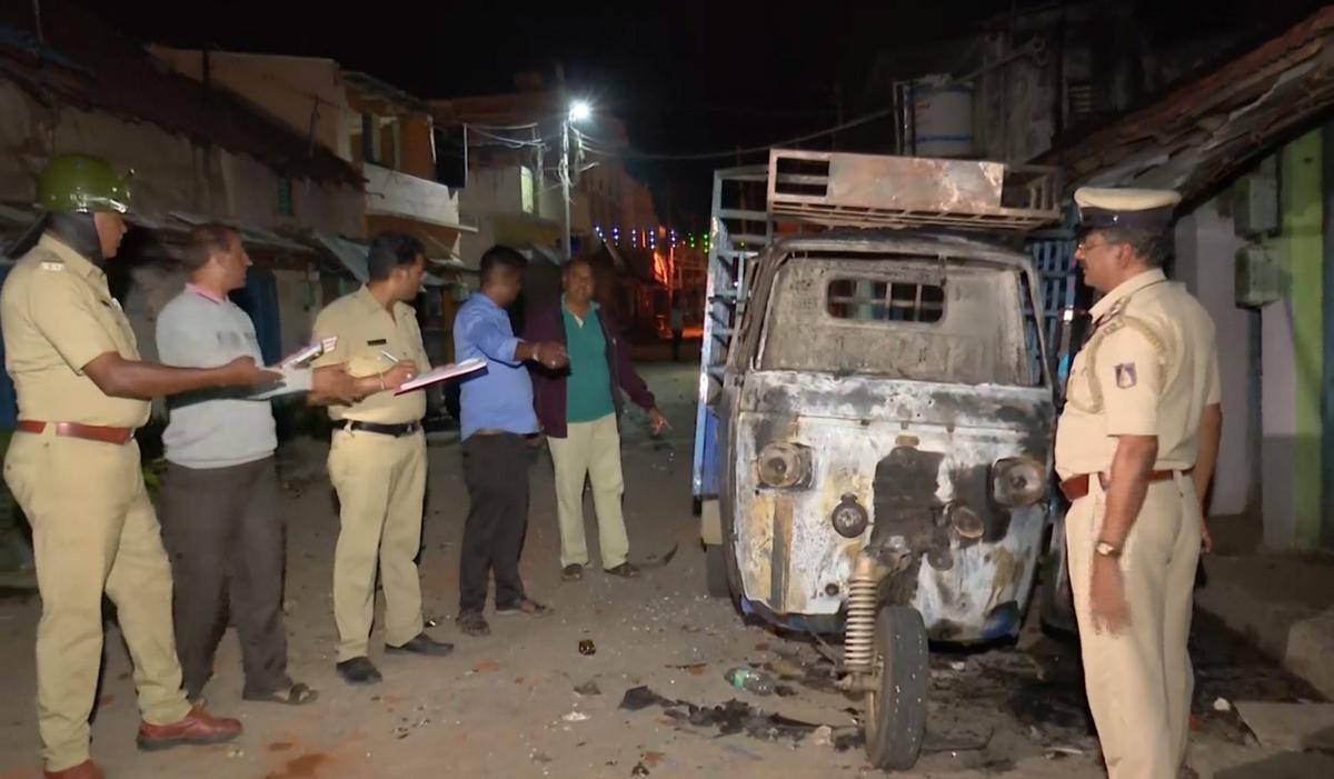 Police officials during an inspection of the site after two groups clashed during a Ganesha Chaturthi procession at Nagamangala in Mandya district, Police officials during an inspection of the site after two groups clashed during a Ganesha Chaturthi procession at Nagamangala in Mandya district,