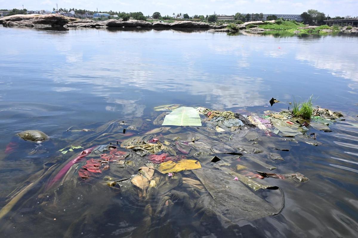 Discarded materials pile up on the banks of the Cauvery near Arulmigu Sangameswarar Temple, at Bhavani in Erode district