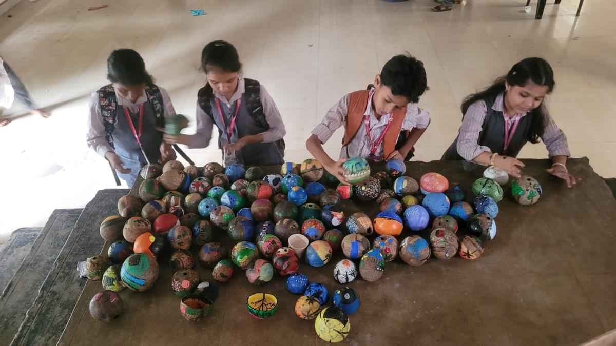 Students of P Bhaskaran Memorial Higher Secondary School painting the coconuts for an installation celebrating the song ‘Nalikerathinte naattil enikkoru’ written by the poet-lyricist. The installation has 100 coconuts