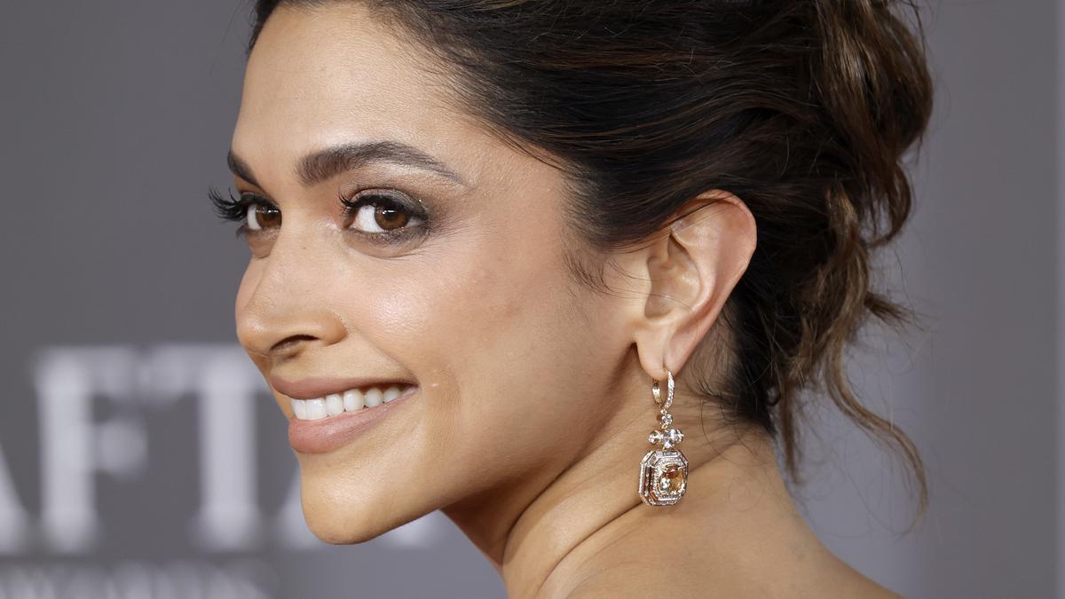 Deepika Padukone presents Jonathan Glazer with BAFTA award