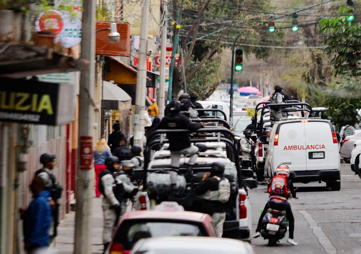 A forensic ambulance believed to be transporting the body of Mexican drug lord Nemesio Oseguera, known as 'El Mencho,'leaves the Specialized Prosecutor's Office for Organised Crime (FEMDO), following a military operation in which a government source said he was killed, in Mexico City, Mexico, on February 22, 2026.