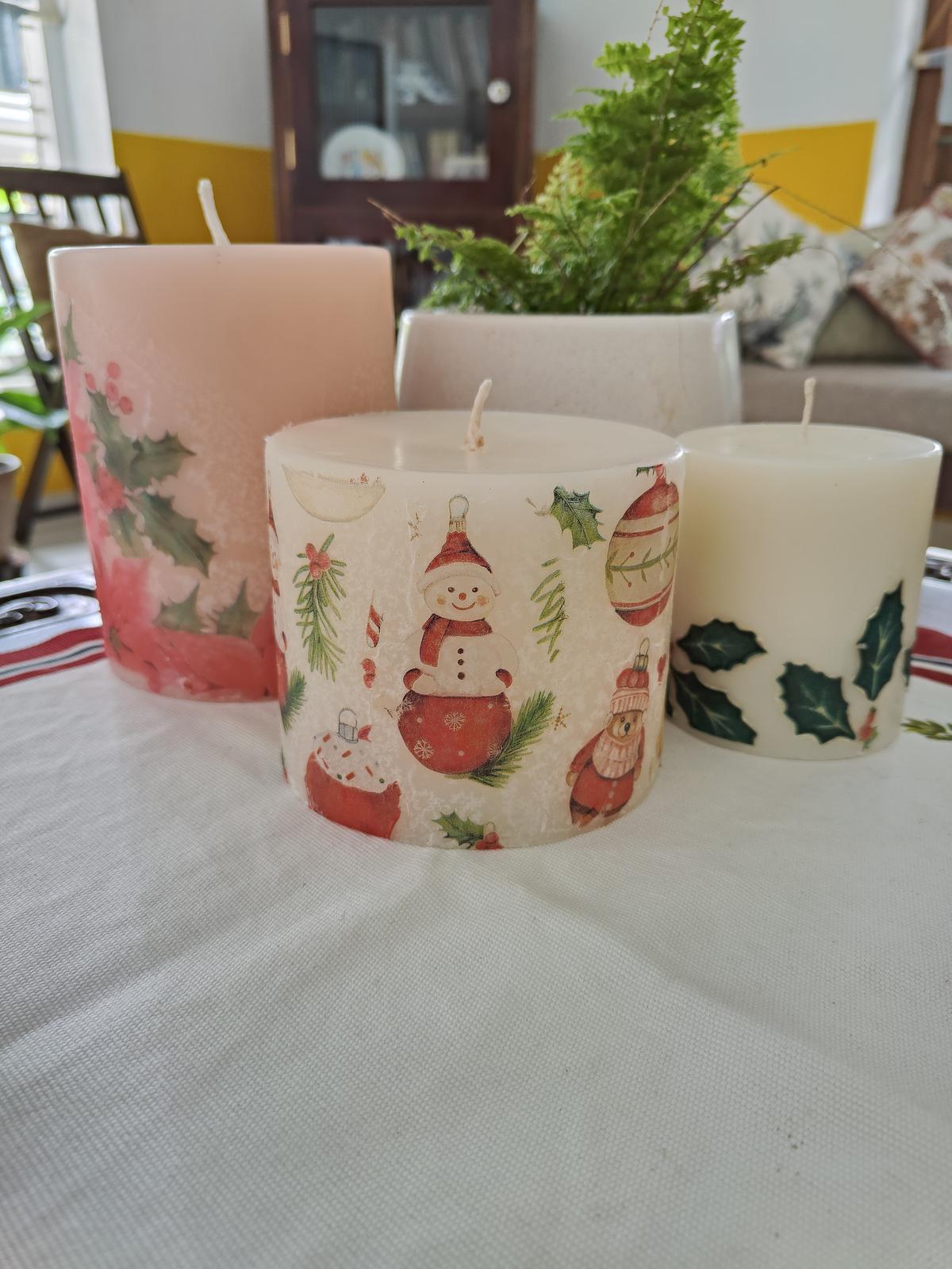 Scented, decorated candles made by Anna Thomas under her label Candle With Care. 