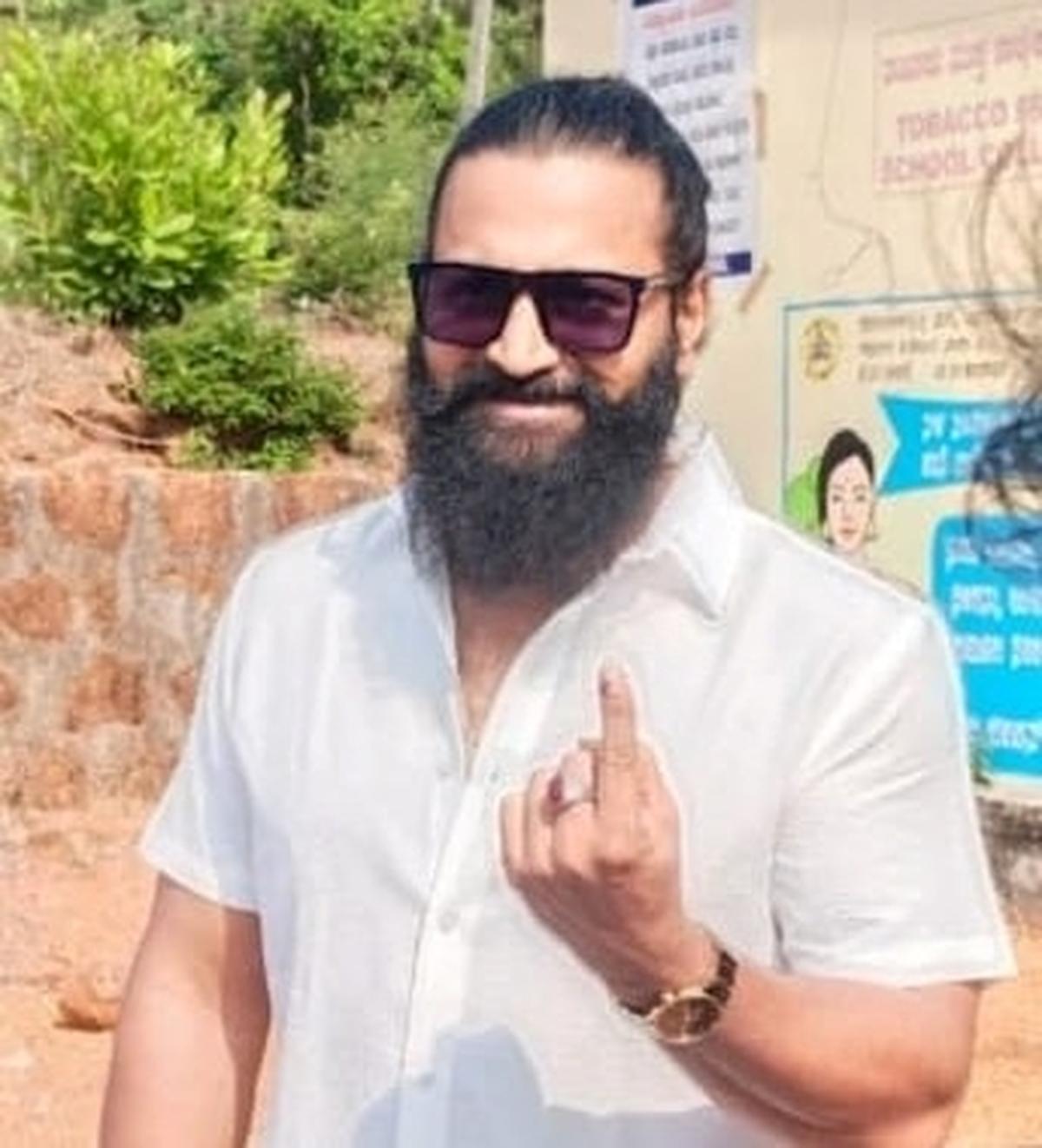 Actor Rishabh Shetty after he cast his vote at a polling station at Keradi village in Byndoor Assembly Constituency, Udupi on Tuesday.