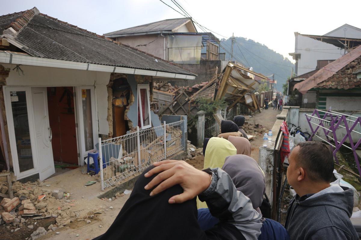 Residents react as they inspect houses damaged by Monday’s earthquake in Cianjur, West Java, Indonesia on November 22, 2022.