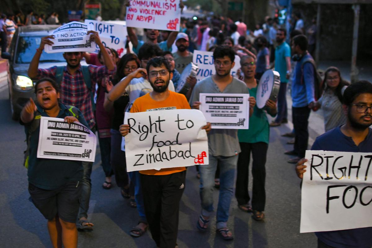 Students from Jawaharlal Nehru University Students’ Union form a human chain protesting against attack on students by Akhil Bharatiya Vidyarthi Parishad activists, at JNU campus, New Delhi, in  2022. 