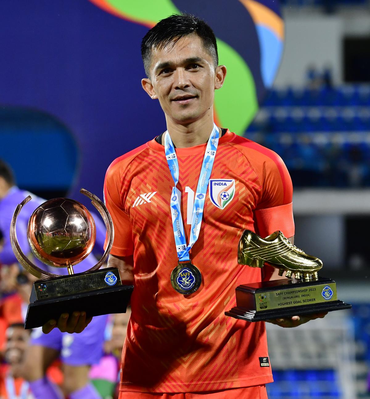 Sunil Chhetri holds the awards for best player and top goalscorer after India won the 2023 SAFF Championship beating Kuwait in the final, in Bengaluru on July 4, 2023.