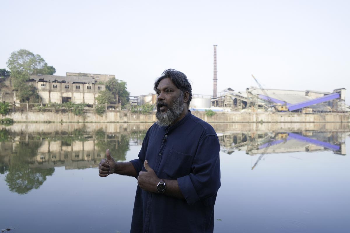 Anwar C. I., an official of the Periyar River anti-pollution committee, speaks during an interview along the river in Eloor, Kerala state, India, Friday, March 3, 2023. He said residents have grown accustomed to the all-pervasive reek that seems to hang over the place like a heavy curtain, enveloping everything and everyone. 
