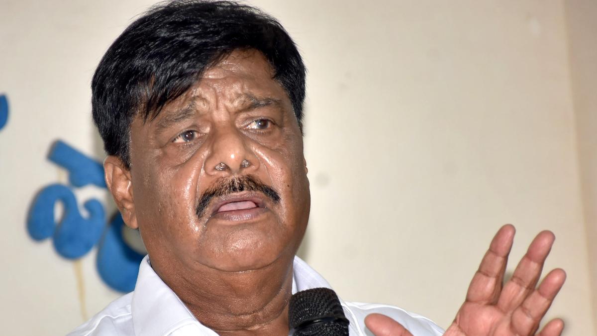 Video of Karnataka minister being 'helped' by gunman to wear shoes goes viral