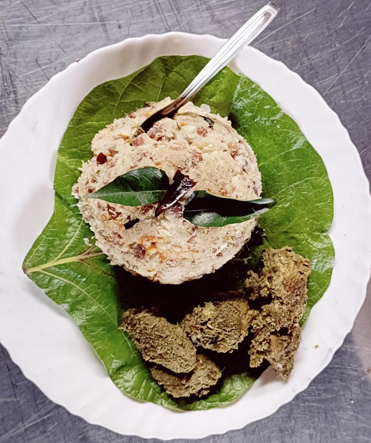 Solai milan, a tribal dish from Attappady. Chicken pieces cooked in bamboo steamer is served with a millet-based dish.