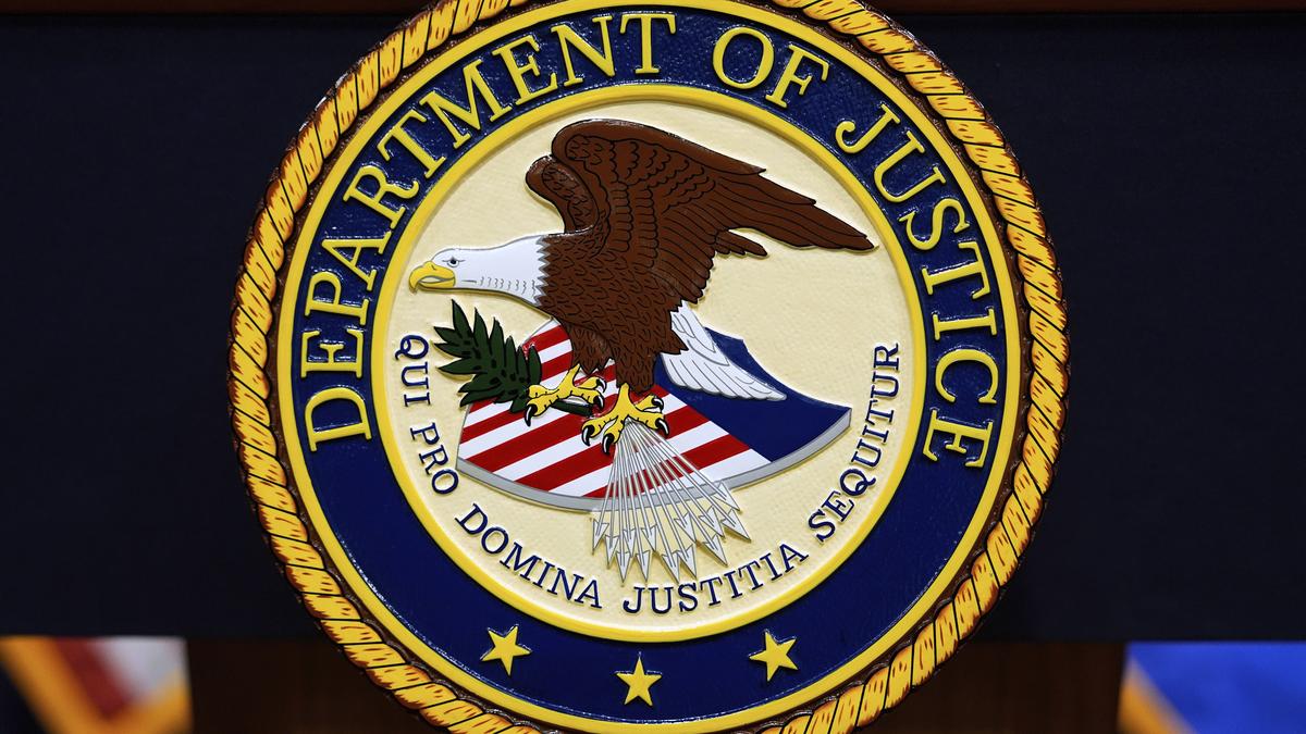 Justice Department says 2 Chinese nationals charged with spying inside the U.S. for Beijing