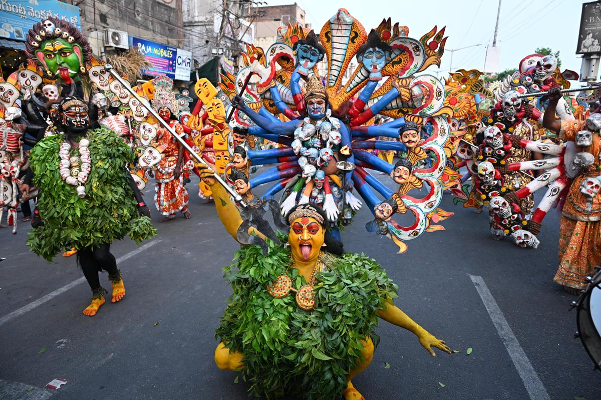 Folk artist performing during the annual Rathotsavam at Canal Road in Vijayawada on Monday.