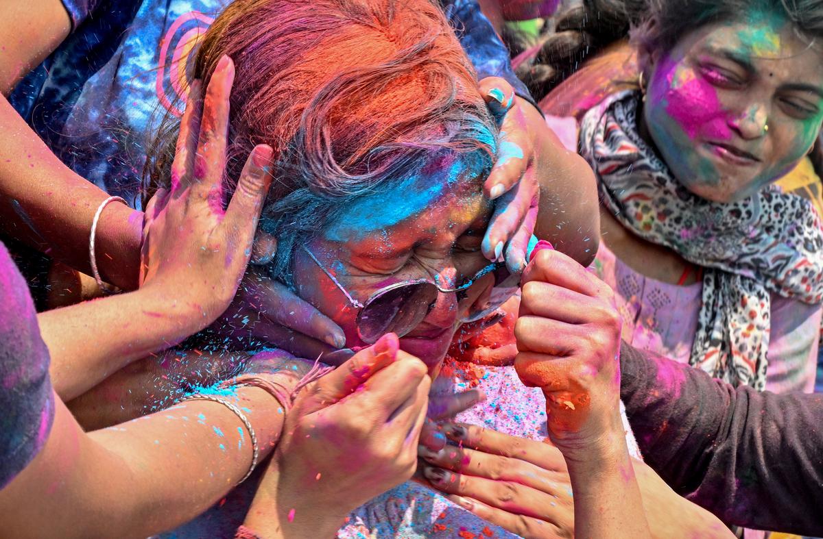 Youngsters celebrating Holi on the Beach Road in Visakhapatnam on Friday. 