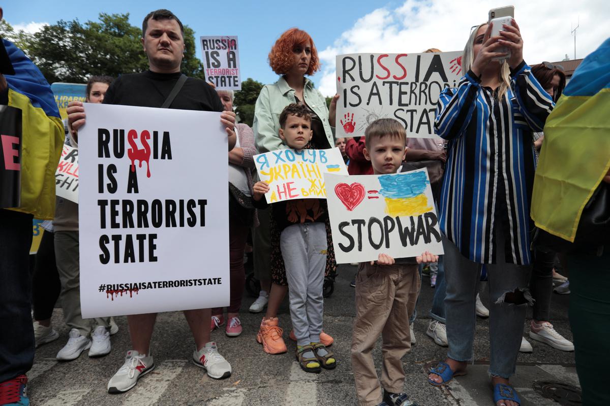 Protesters at an anti-Russian demonstration outside the Russian Embassy in Warsaw, Poland. 