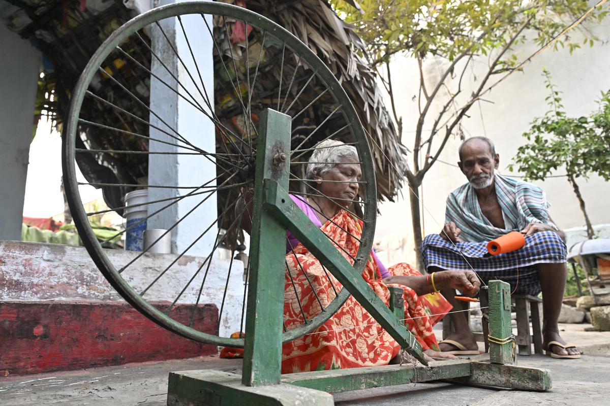 A weaver couple spinning yarn for use in the handloom products at Mangalagiri in Guntur district. 