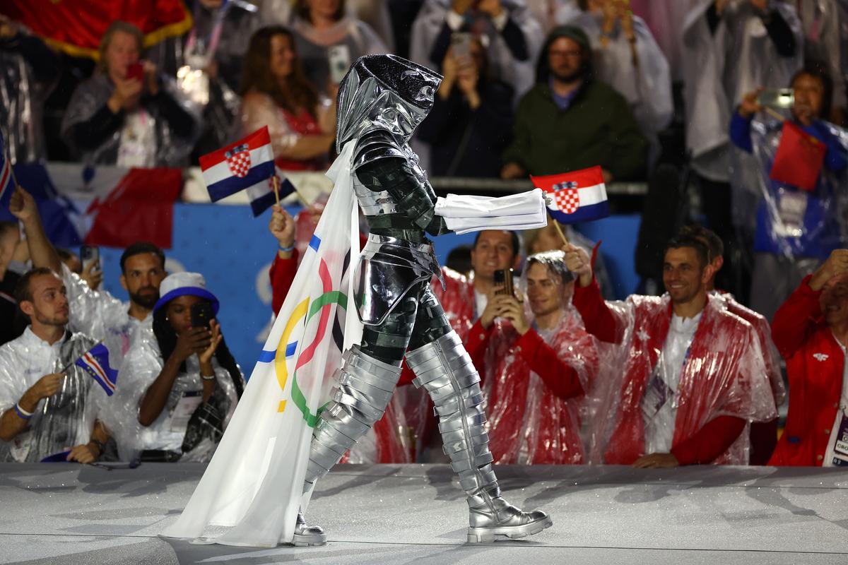 The Olympic Flag is presented by the The Horsewoman at Place du Trocadero during the opening ceremony of the Olympic Games Paris 2024 on July 26, 2024 in Paris, France.