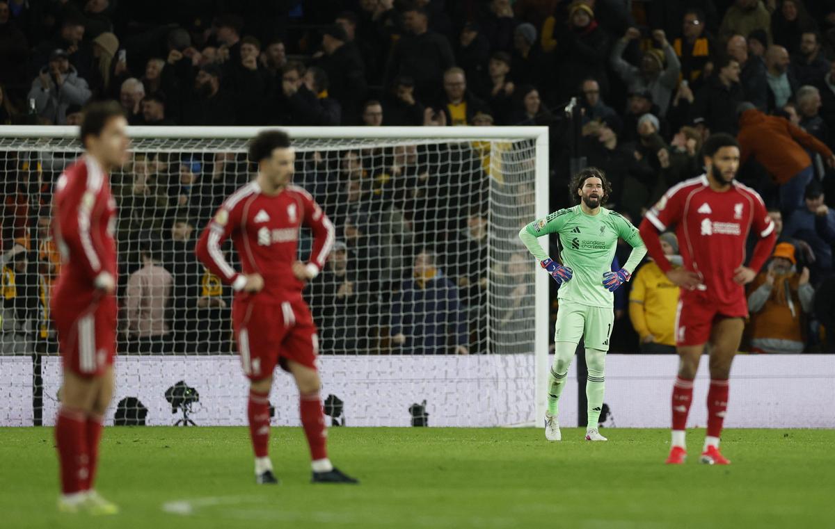 Liverpool's Alisson Becker looks dejected after Wolverhampton Wanderers' Andre scores their second goal